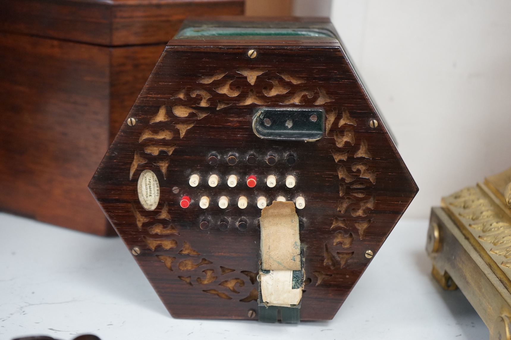 A Wheatstone concertina, in rosewood case, case 16.5cm high. CITES Submission reference, PS7AQEEA